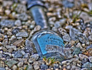 Stoned bottle in sand